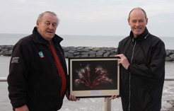 Mike Stevens (right) presents a framed photograph to Dilwyn Davies